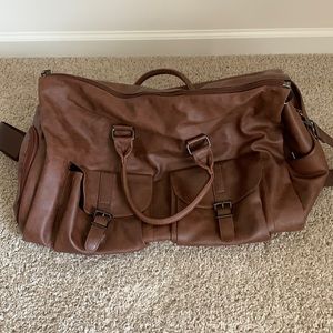 Brown leather garment and shoe bag.